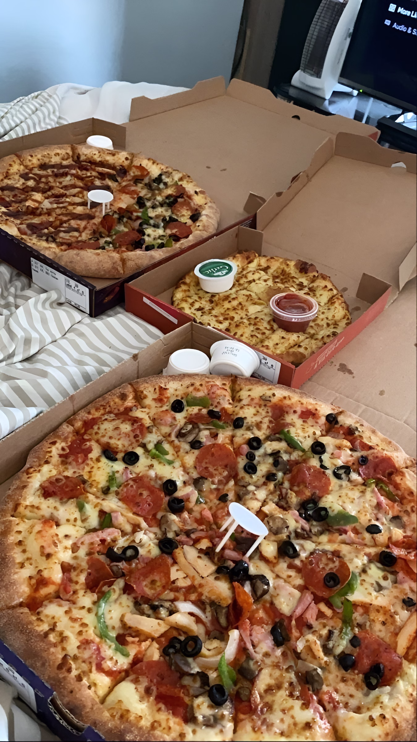 Delicious pizzas in delivery boxes